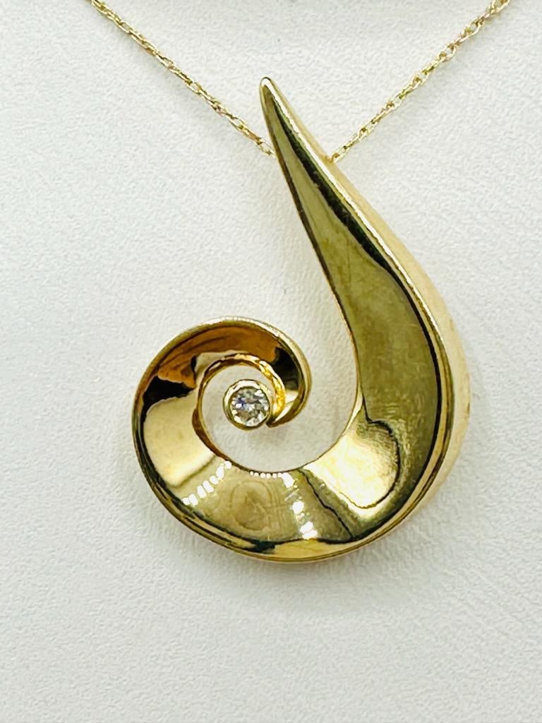 14 KT Yellow Gold Natural Diamond Pendant and Chain # 2116: # 2116 14 KT Yellow Gold Natural Diamond Pendant and Chain 1 piece diamond 0.05 carat 18” chain with spring ring clasp closure Pendant and Chain Weight: 3.40 grams Pendant: 28 mm x 20 mm