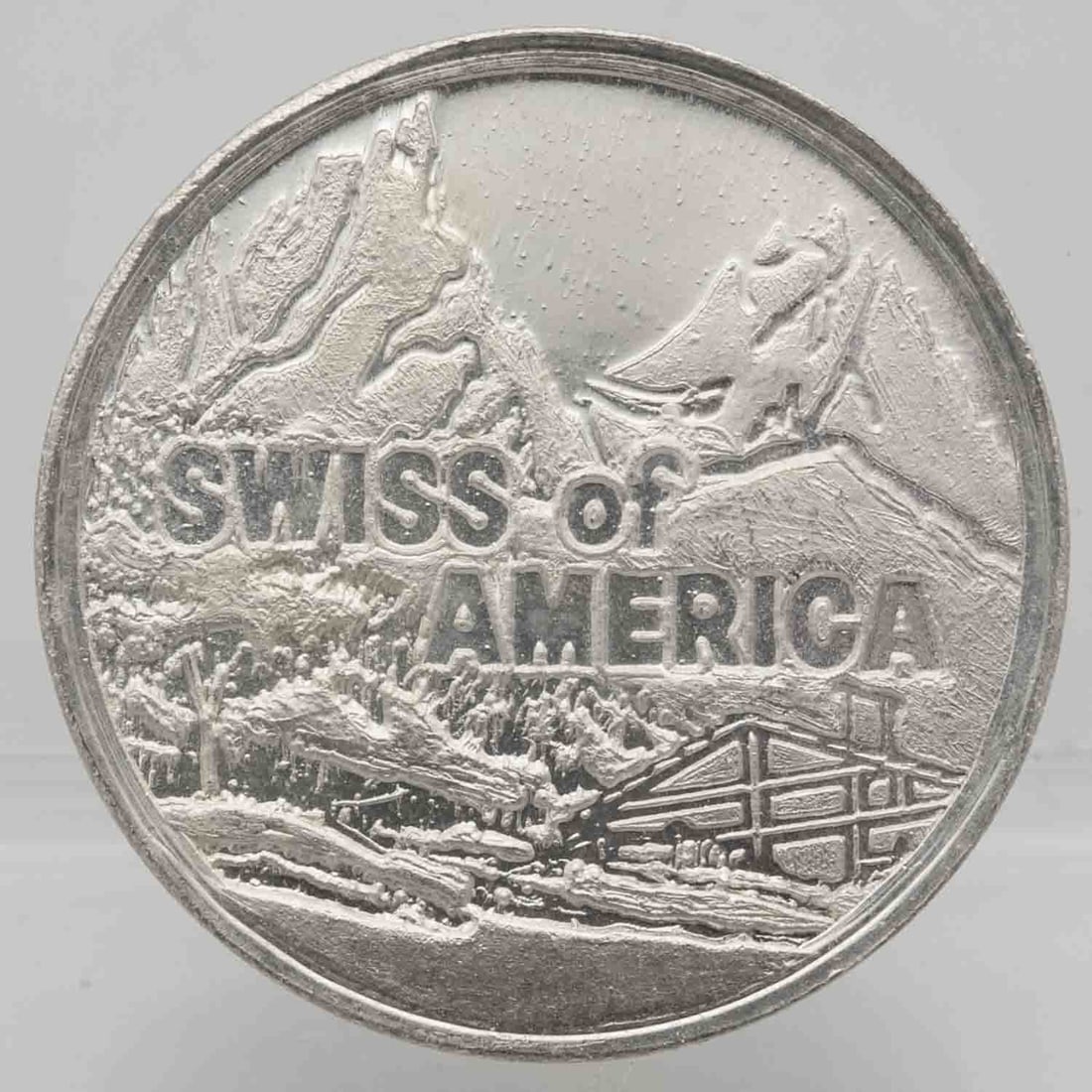 Vintage Swiss Of America 1oz Silver Round: Subject: Swiss of America 1oz Silver Round Medium: 999 Silver Year: Vintage Condition: AU Note: Any condition statement is given as an opinion and should not be treated as a statement of fact. Please 