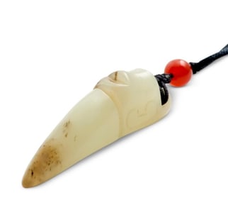 A CHINESE WHITE JADE CARVED HUMAN FACED PENDANT, QING DYNASTY (1644 - 1911)