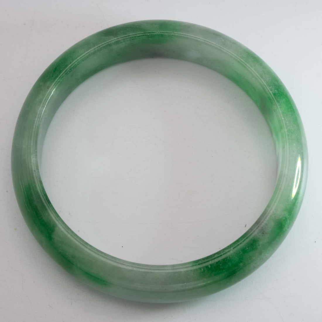 Chinese Green Jade Bangle: Medium: Green Jade Size: 2.3 inches inner diameter Age/Detail: Chinese Condition: great overall, check photo for condition reference. Provenance: Collection from Estate in Tribecca LiveShipping is NOT