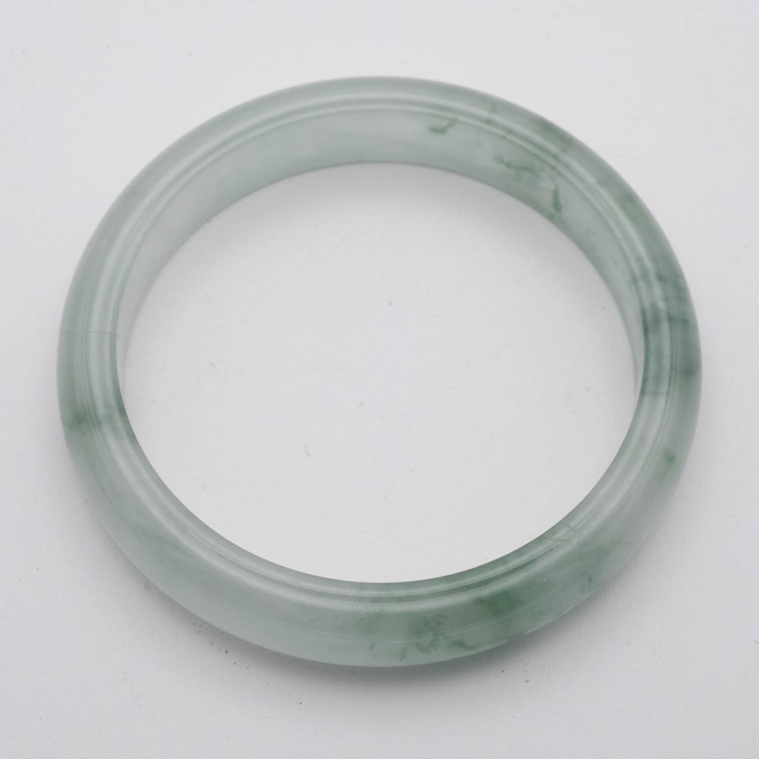 Chinese Icy Green Jade Bangle: Medium: Icy Green Jade Size: 2.5 inches Age/Detail: Chinese Condition: great overall, check photo for condition reference. Provenance: Collection from Estate in Williamsburg LiveShipping is NOT a part
