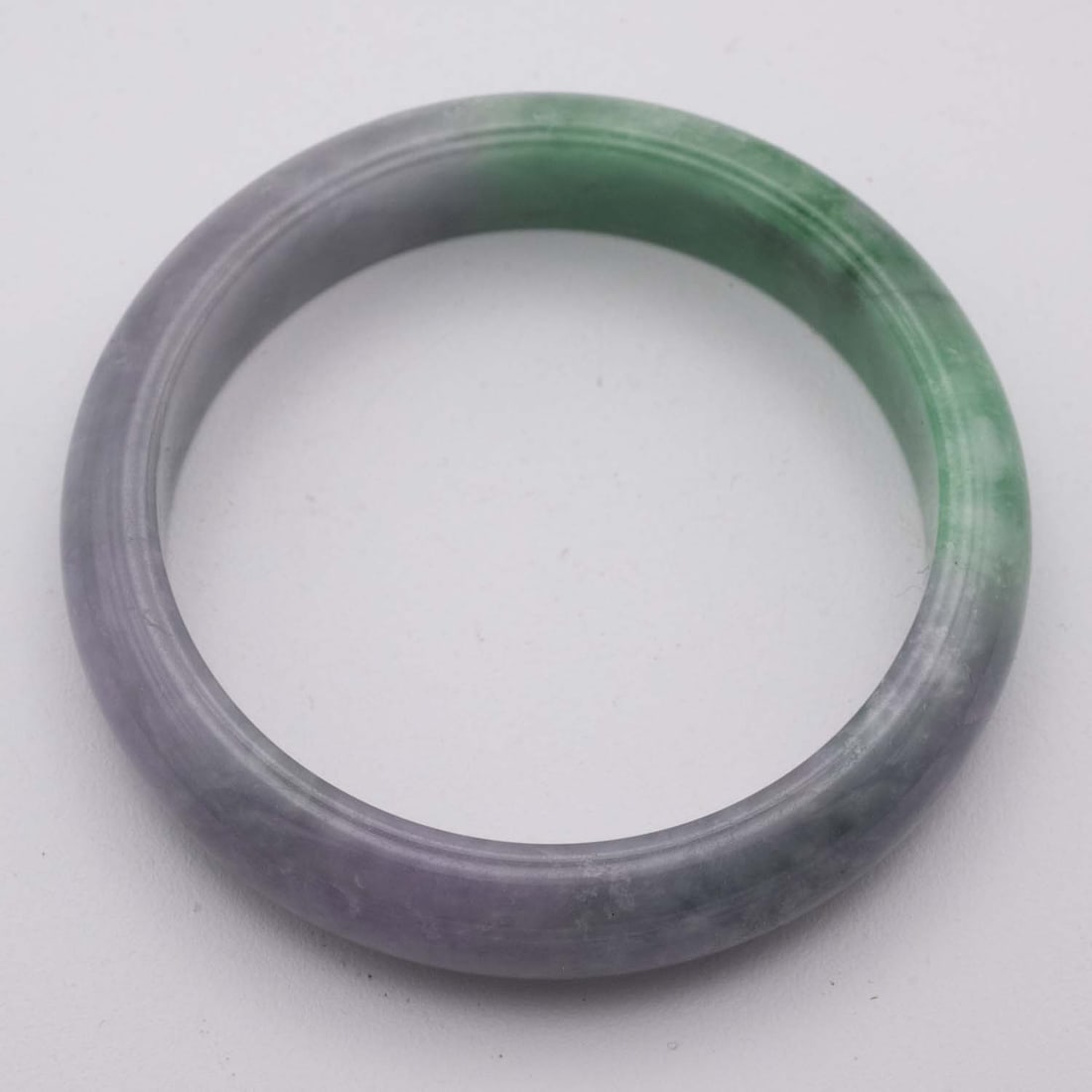 Chinese Lavender And Green Jade Bangle: Medium: Lavender And Green Jade Size: 2.3 inches Age/Detail: Chinese Condition: great overall, check photo for condition reference. Provenance: Collection from Estate in Williamsburg LiveShipping is N