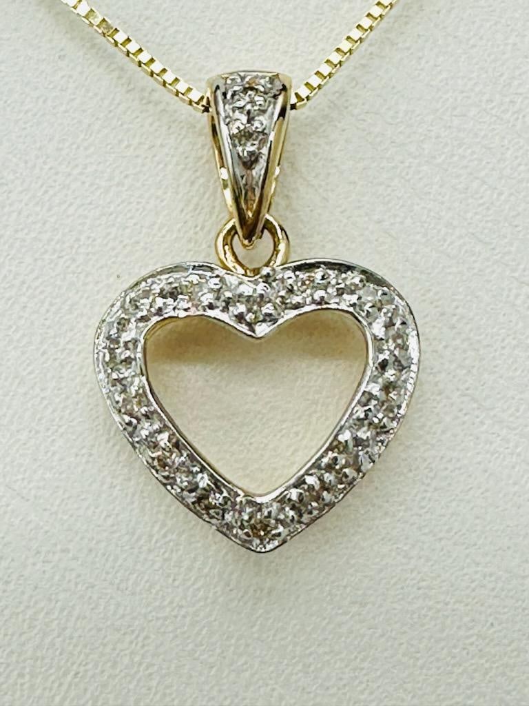14KT Yellow Gold Natural Diamond Heart Pendant and Chain # 2126: # 2126 14KT Yellow Gold Natural Diamond Heart Pendant and Chain 16 pieces diamond 0.08 carat (t.w.) 18” box chain with spring ring clasp closure Pendant and Chain Weight: 1.90 grams Pendant size