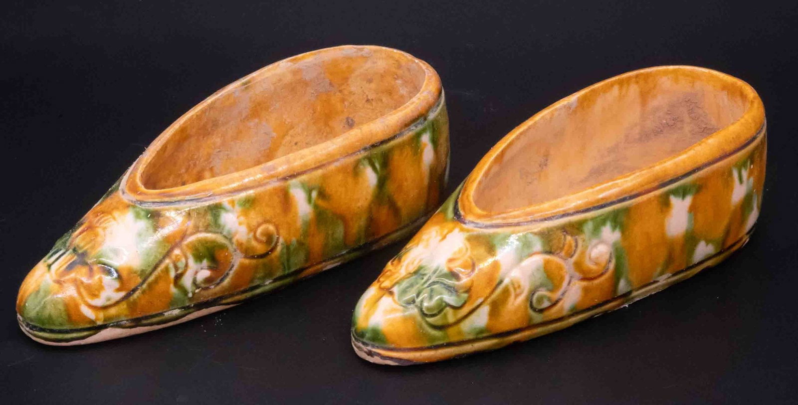 A Pair Of Old Porcelain Tang Sancai Shoes: Medium: Porcelain Size: 6 Age/Detail: Old Condition: Great Provenance: Collection from Estate in Tribecca Please view all the photos as they are part of the condition description report. All items are