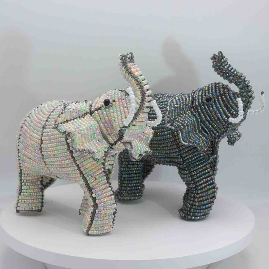 A Pair Of African Beaded Elephant Figures: Medium: Beaded Size: 6.5x4.5x6 inches/each Age/Detail: A Pair Of African Condition: great overall, check photo for condition reference. Provenance: Collection from Estate in Williamsburg LiveShipping 
