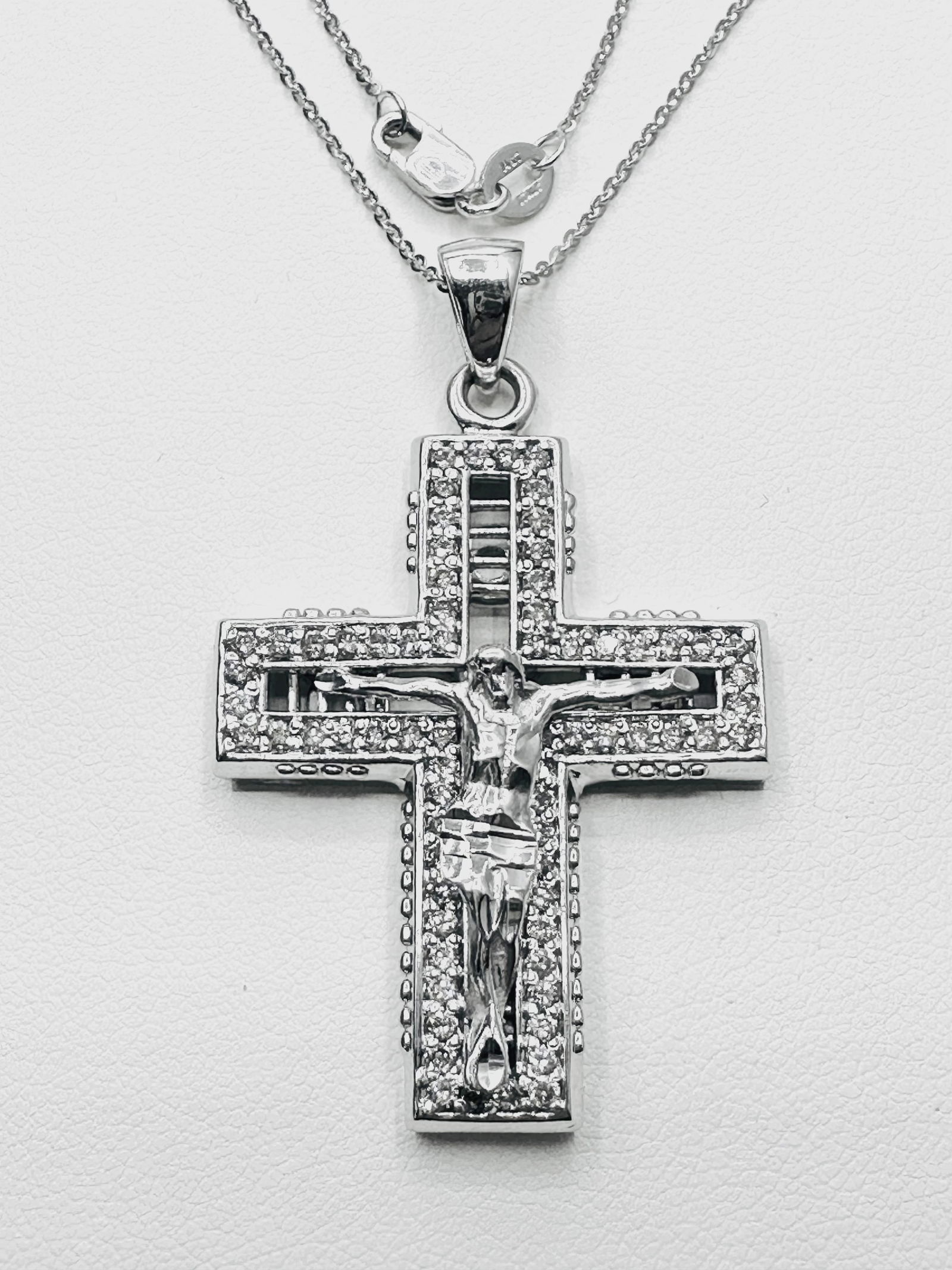 14KT White Gold 70 Pcs Natural Diamond 1.45 Ct Necklace - J11168: * 14KT White Gold Natural Diamond Cross Pendant with Jesus and 16” Fancy Chain * 70 pcs round diamond 1.45 Carats (t.w.) * Clarity VS-SI, Color G-K * Pendant and Chain Weight 12.50 Grams * Penda