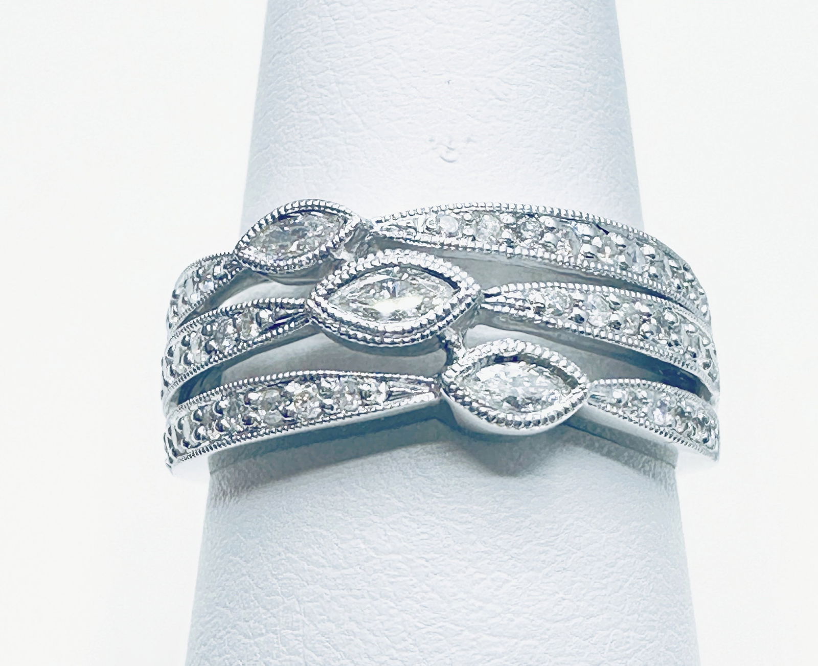 14 KT White Gold Natural Diamond 3 Row Ring Size 7.25 - J11207: *14 KT White Gold Natural Diamond 3 Row Ring *45 pcs round and marquis diamond 0.55 carat (t.w.) *Ring Weight: 5.00 grams *Ring Size 7.25 *Diamond Clarity VS-SI, Color G-K *Condition: New in Box *J112