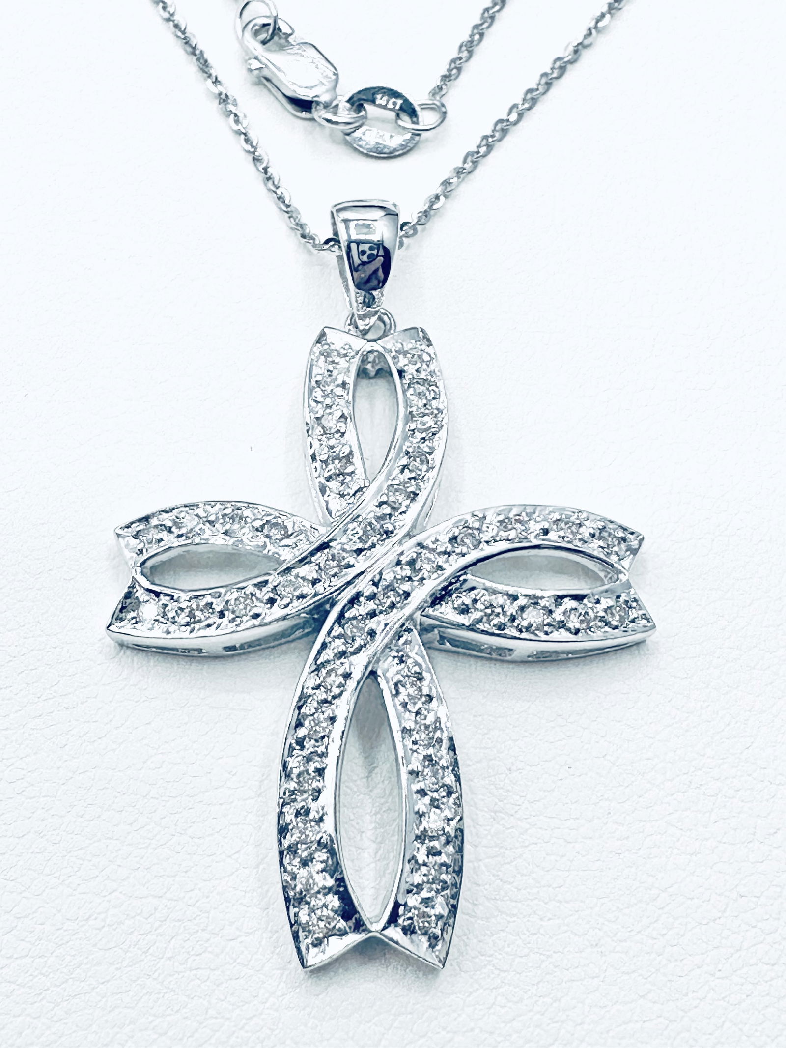 14KT White Gold Natural Diamond Infinity Cross Pendant With 16 Chain - J11220: *14KT White Gold Natural Diamond Infinity Cross Pendant with 16” Chain. *42 pcs diamond 0.38 Carat(t.w.) *Total Weight 7.00 grams (t.w.) *Pendant measurement 40 mm x 27 mm *Lobster clasp closure