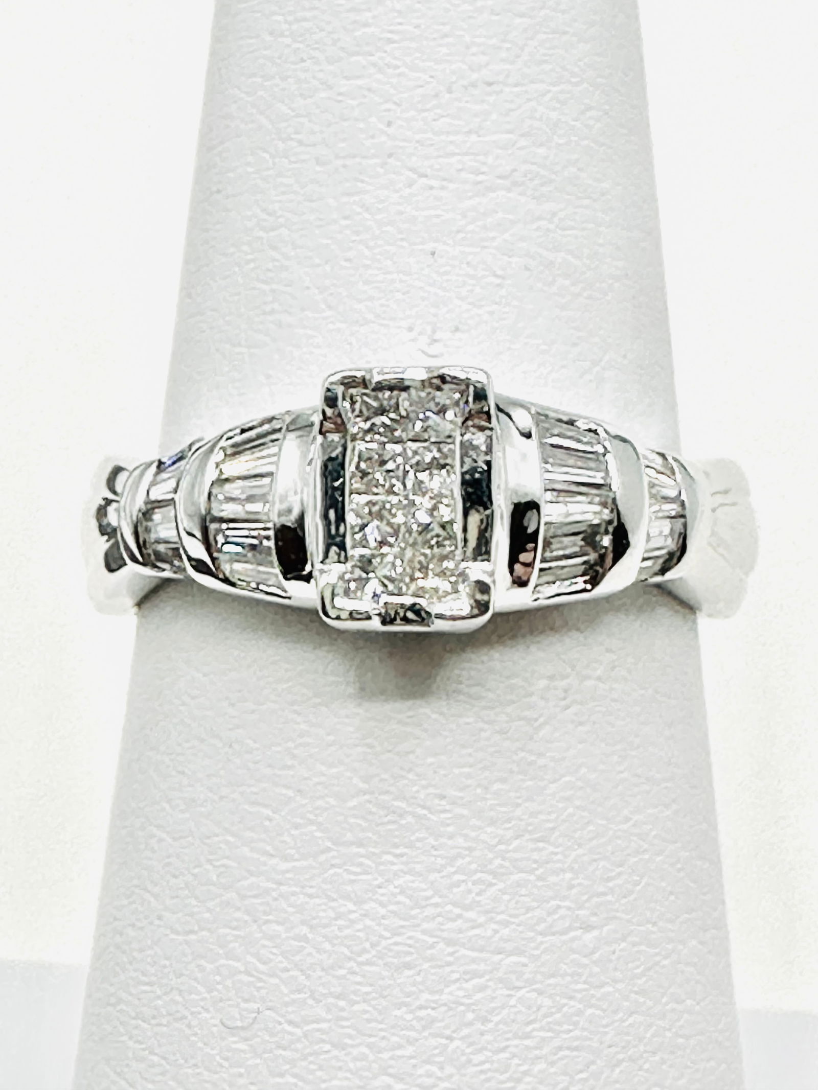 14KT White Gold Diamond Fancy Ring Size 6.75 - J11334: * 14KT White Gold Diamond Fancy Ring * 26 pcs Princess Cut and Baguette Cut Diamond 0.55 carat (t.w.) * Ring Weight: 4.60 grams * Ring size 6.75 * Diamond Clarity VS-I, Color G-K, * Condition: New in