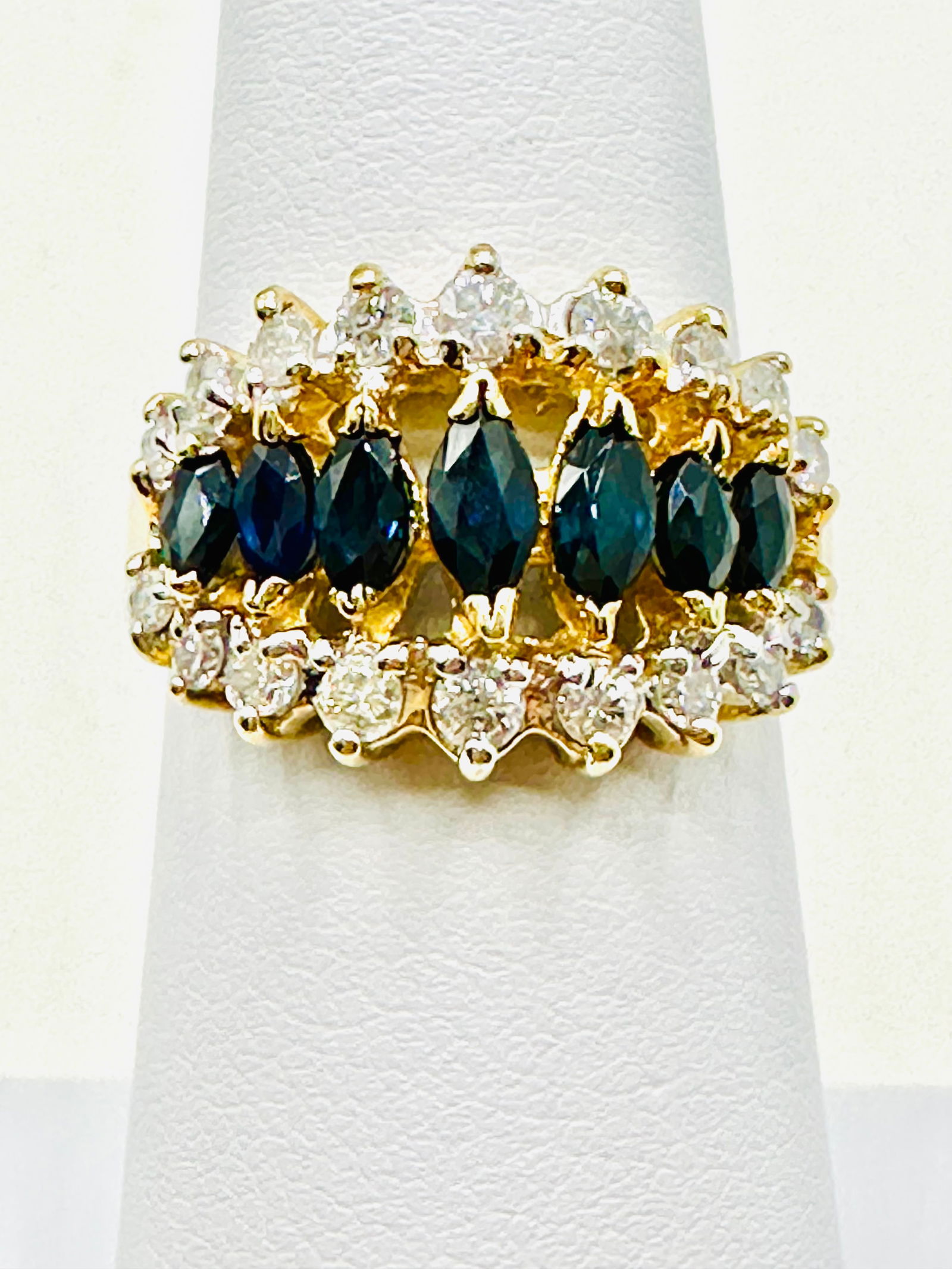 14KT Yellow Gold Sapphire And Diamond Ring Size 6 - J11364: * 14KT Yellow Gold Sapphire and Diamond Ring * 18 Pcs Diamond 0.55 carat(t.w.) * 7 pcs marquis shaped sapphire 1.00 carat * Ring Weight: 4.70 grams * Ring size 6 * Diamond Clarity VS-I, Color G-K, * C
