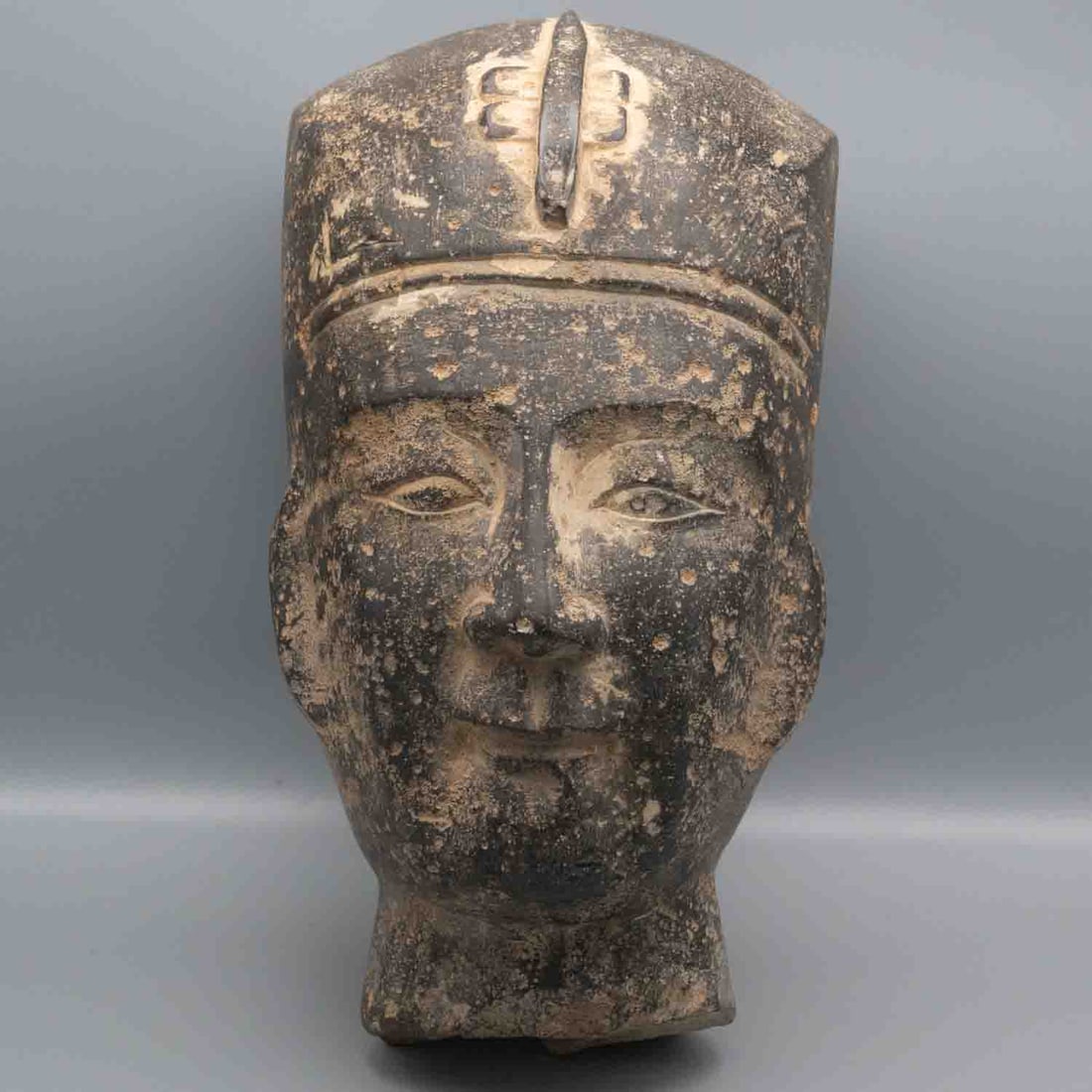 Old Egyptian Carved Stone Head Figure: Medium: Stone Size: 10.5x6x8 inches Age/Detail: Old Egyptian Carved Condition: great overall, check photo for condition reference. Heavy carved stone head in the Egyptian manner, depicting a stylized
