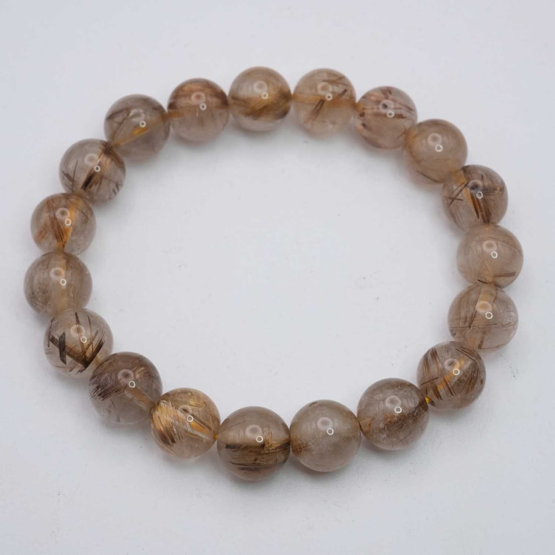 Natural Golden Rutilated Quartz Bracelet: Medium: Golden Rutilated Quartz Size: 10mm diameter each bead Age/Detail: Natural Condition: great overall, check photo for condition reference. Provenance: Collection from Estate in Williamsburg Live