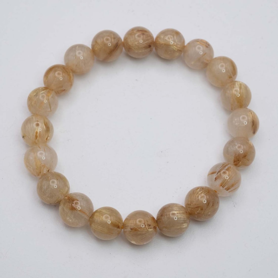Natural Golden Rutilated Quartz Bracelet: Medium: Golden Rutilated Quartz Size: 10mm diameter each bead Age/Detail: Natural Condition: great overall, check photo for condition reference. Provenance: Collection from Estate in Williamsburg Live