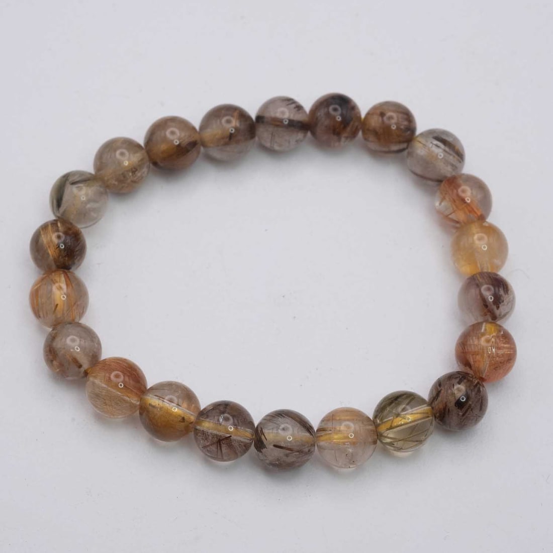Natural Golden Rutilated Quartz Bracelet: Medium: Golden Rutilated Quartz Size: 9mm diameter each bead Age/Detail: Natural Condition: great overall, check photo for condition reference. Provenance: Collection from Estate in Williamsburg LiveS