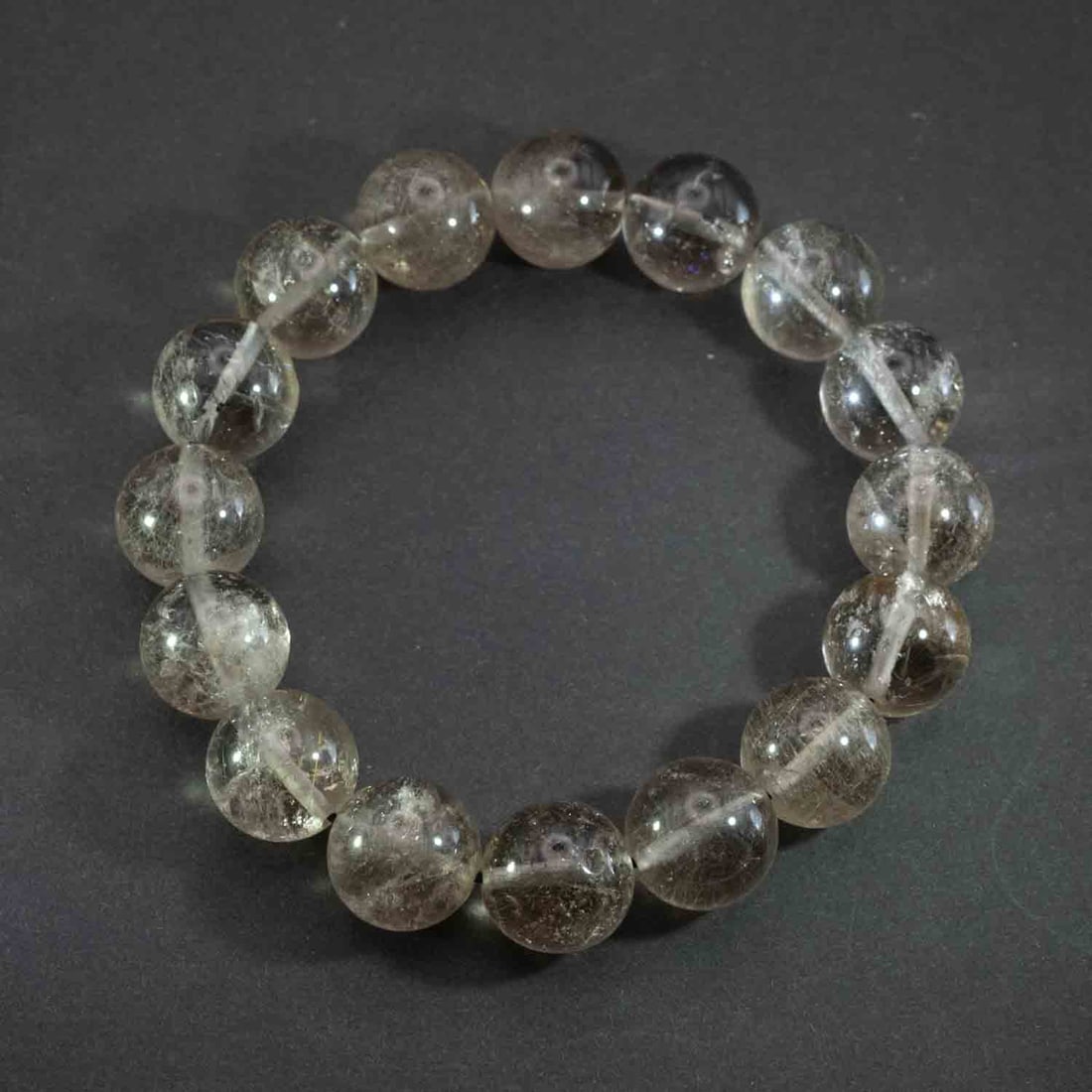 Vintage Natural Rutilated Quartz Bead Bracelet: Medium: Rutilated Quartz Size: 13mm Age/Detail: Vintage Natural Condition: great overall, check photo for condition reference. Provenance: Collection from Estate in Williamsburg LiveShipping is NOT a