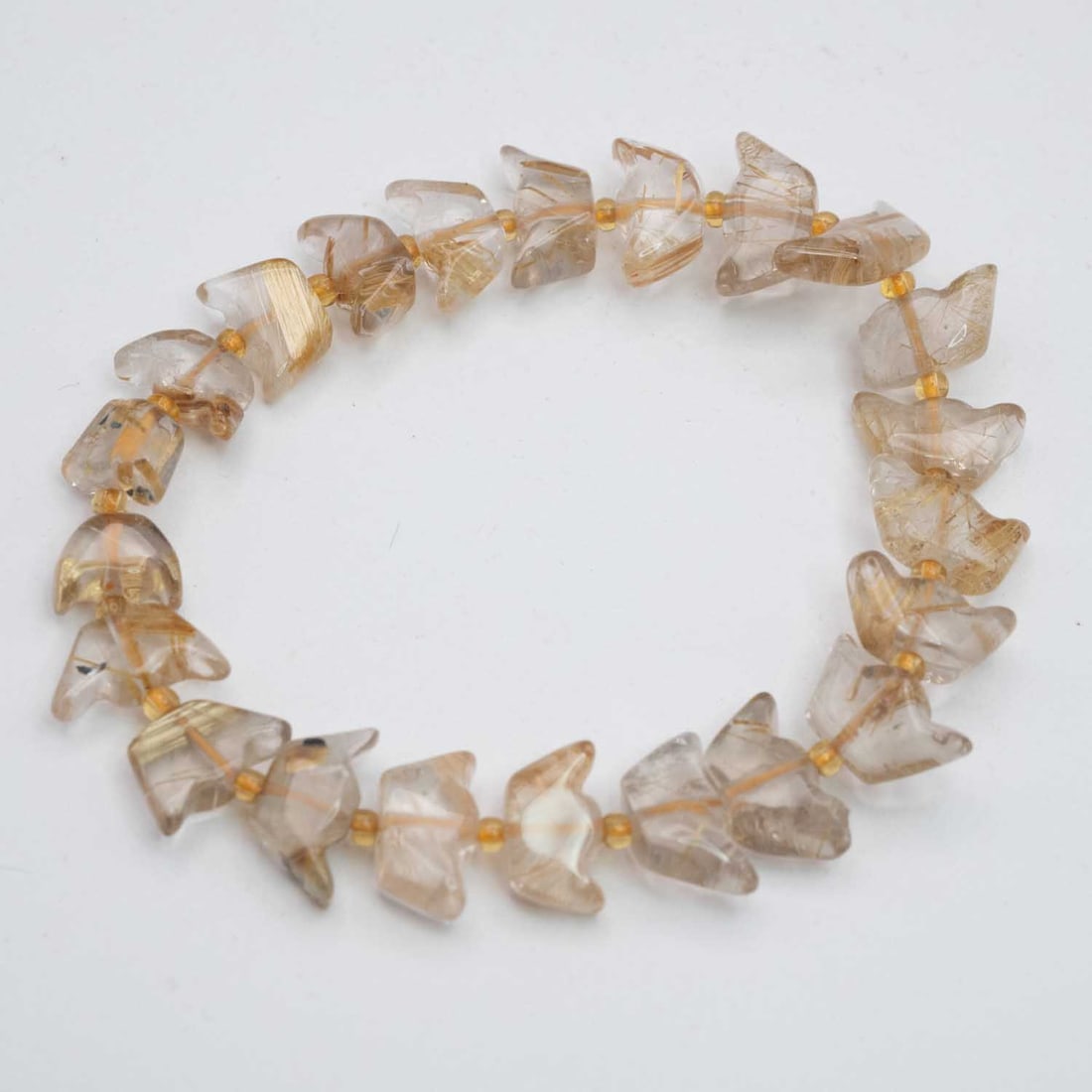 Natural Golden Rutilated Quartz Yuanbao Bracelet: Medium: Golden Rutilated Quartz Size: 10x6mm Age/Detail: Natural Condition: great overall, check photo for condition reference. Provenance: Collection from Estate in Williamsburg LiveShipping is NOT a