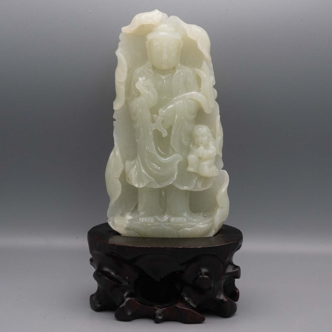 Old Chinese Carved Natural Xiu Jade Guanyin Figure With Stand: Medium: Natural Xiu JadeSize: 8x4x3 inchesAge/Detail: Old Chinese CarvedCondition: great overall, check photo for condition reference.Provenance:Collection from Estate in WilliamsburgLiveShipping is N