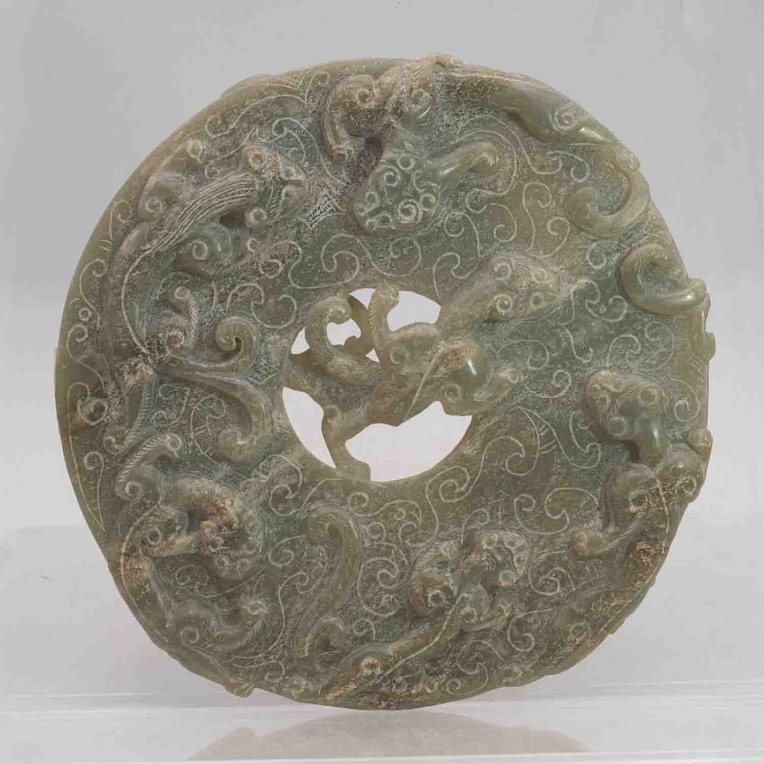 Chinese Carved Nephrite Green Jade Dragon Bi Disc: Medium: Nephrite Green JadeSize: 6x6x0.7 inchesAge/Detail: Chinese CarvedCondition: great overall, check photo for condition reference.Chinese hand-carved nephrite jade bi disc with pierced dragon (ch
