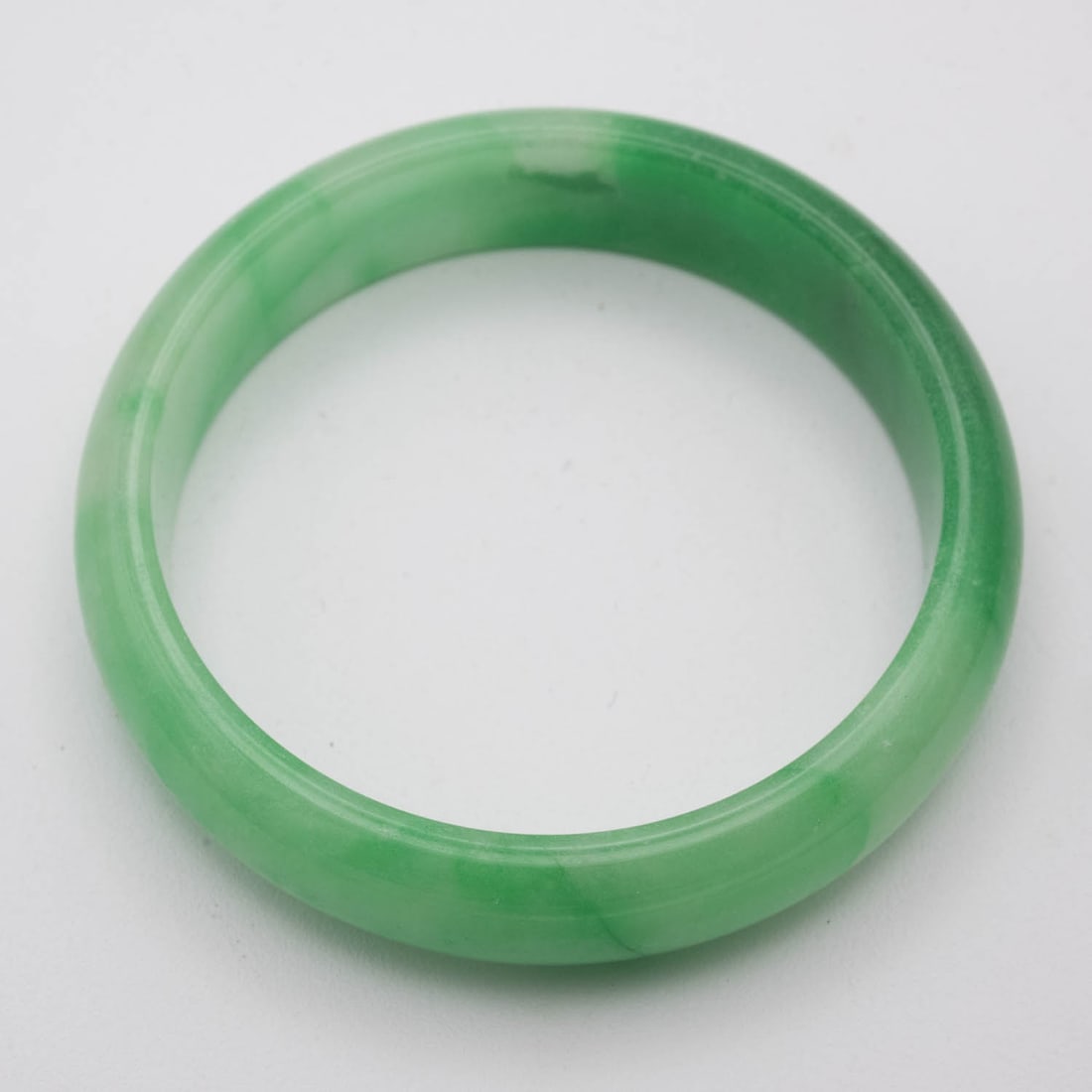 Chinese Translucent Green Jade Bangle: Medium: Translucent Green JadeSize: 2.3 inchesAge/Detail: ChineseCondition: great overall, check photo for condition reference.Provenance:Collection from Estate in WilliamsburgLiveShipping is NOT a pa