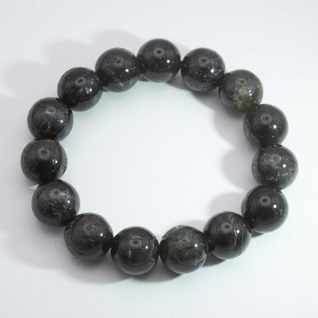 Vintage Natural Black Obsidian Bead Bracelet: Medium: Black ObsidianSize: 13mmAge/Detail: Vintage NaturalCondition: great overall, check photo for condition reference.Provenance:Collection from Estate in WilliamsburgLiveShipping is NOT a part of