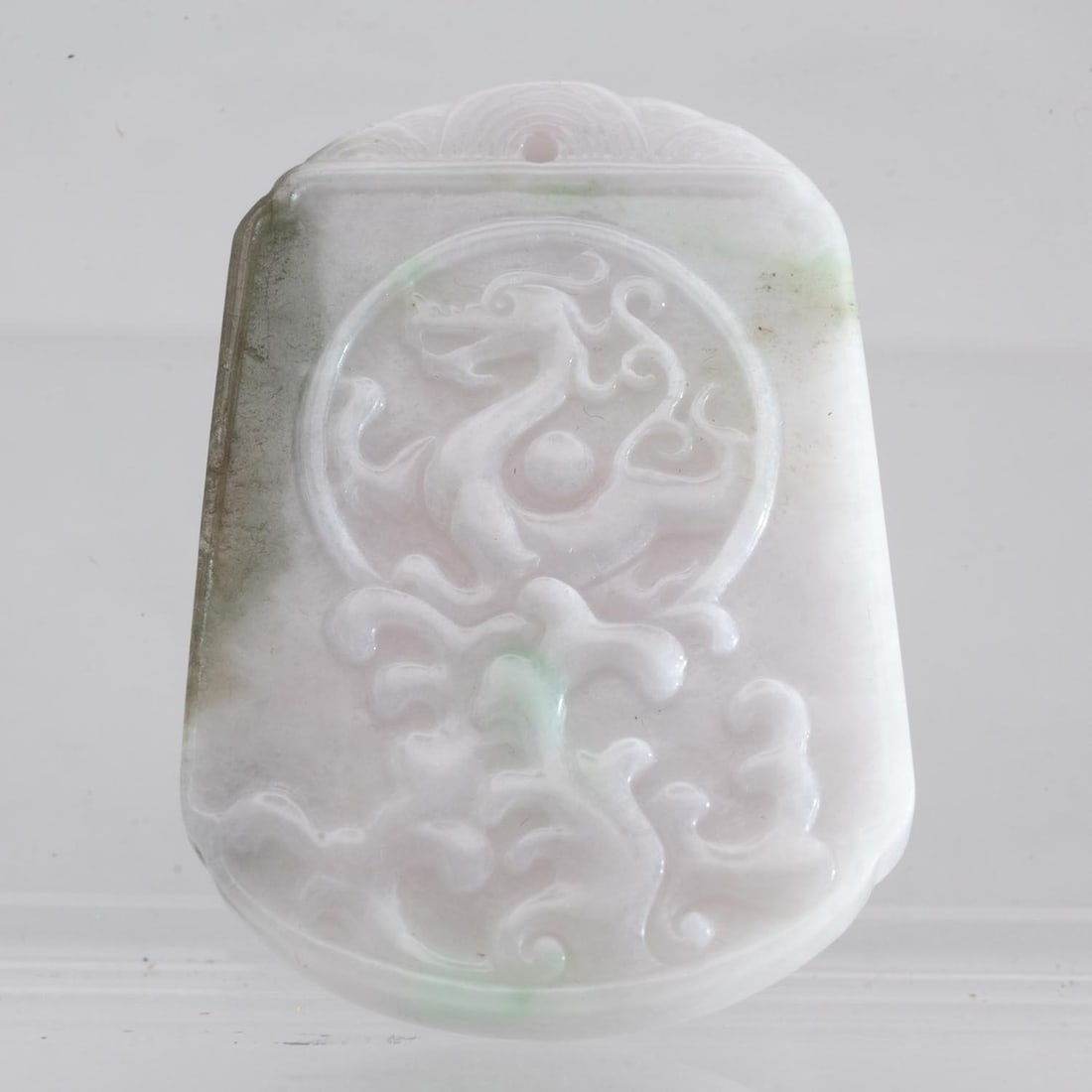 Chinese Carved Natural White Jadeite Dragon Pendant: Medium: Natural White Jadeite Size: 2x1.5x0.3 inches Age/Detail: Chinese Carved Condition: great overall, check photo for condition reference. Provenance: Collection from Estate in Tribecca LiveShippi
