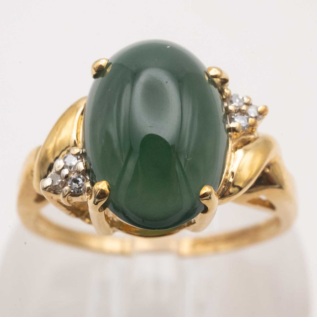 14k Gold And Diamond Cabochon Natural Green Icy Jadeite Ring: Medium: Cabochon Natural Green Icy Jadeite Size: US 6.75, 4.5 gram Age/Detail: 14k Gold And Diamond Condition: great overall, check photo for condition reference Provenance: Collection from Estate in