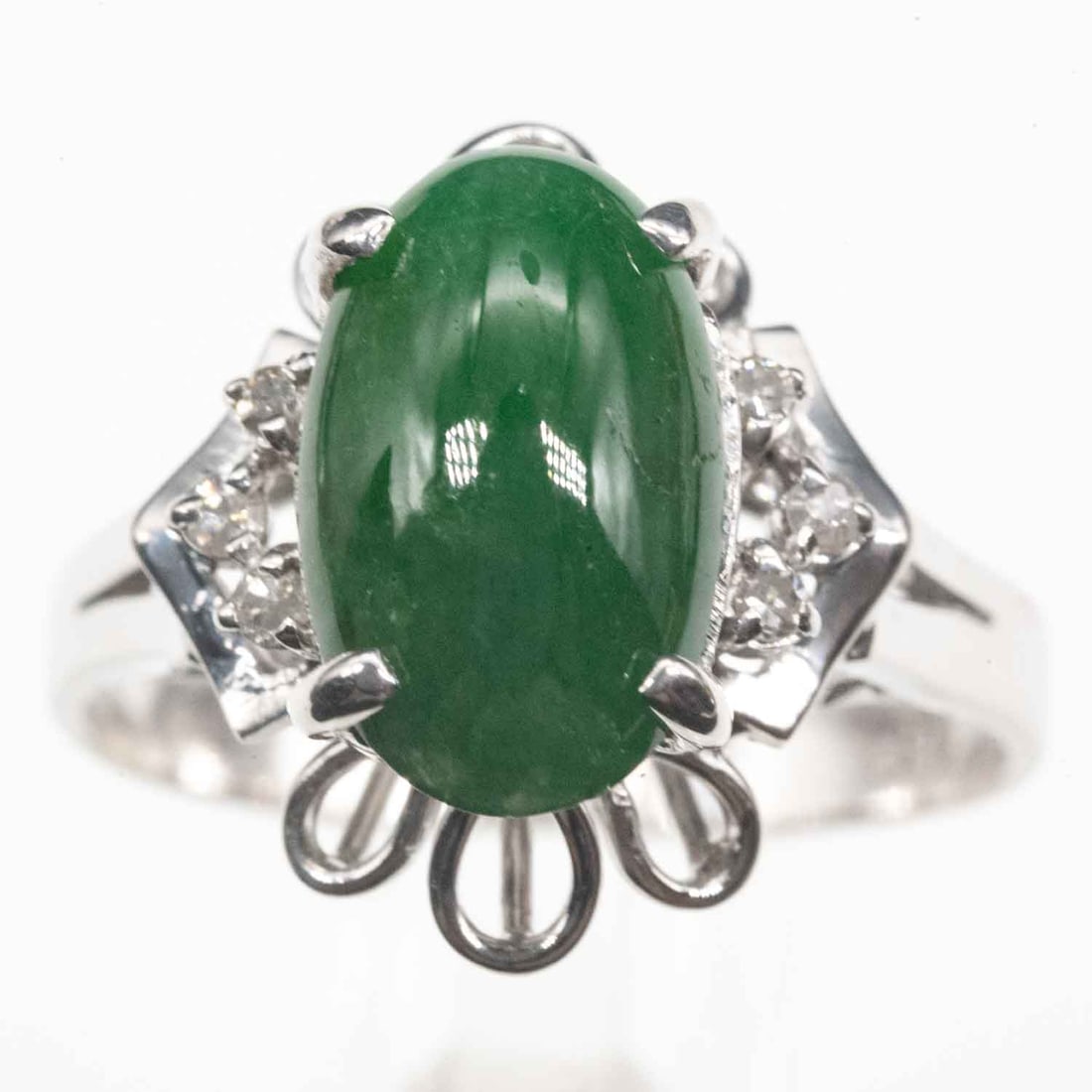 10K White Gold Diamond And Cabochon Jadeite Ring: Medium: Diamond And Cabochon Jadeite Size: US6.5, 3.5g Age/Detail: 10K White Gold Condition: Great overall Provenance: Collection from Estate in Tribecca Please view all the photos as they are part of