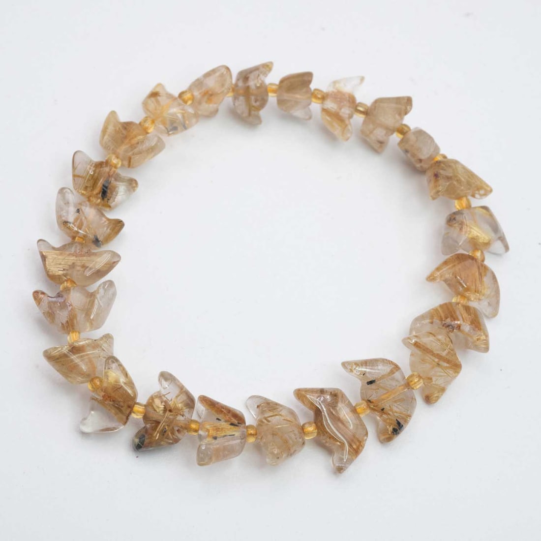 Natural Golden Rutilated Quartz Yuanbao Bracelet: Medium: Golden Rutilated Quartz Size: 11x6mm Age/Detail: Natural Condition: great overall, check photo for condition reference. Provenance: Collection from Estate in Williamsburg LiveShipping is NOT a
