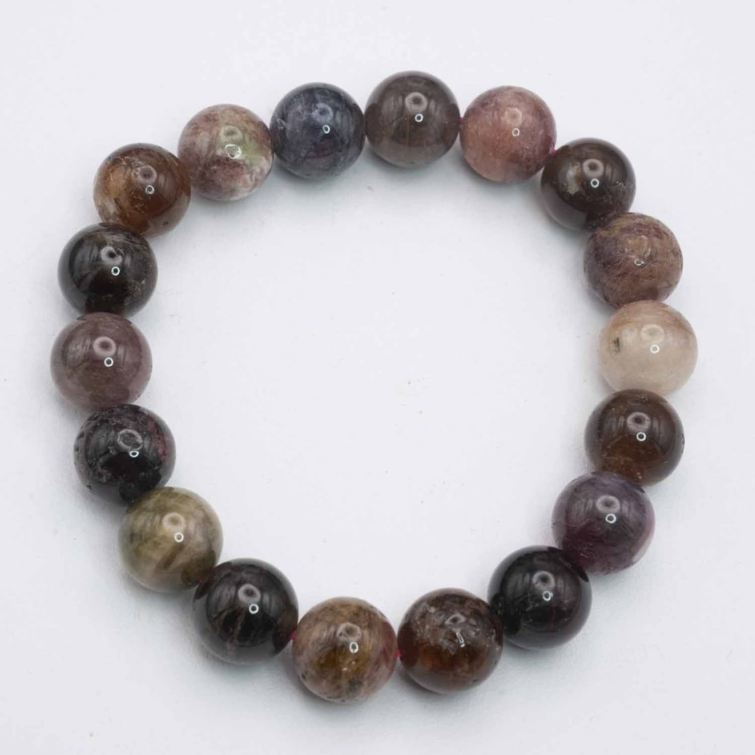 Natural Tourmaline Bead Bracelet: Medium: Tourmaline Size: 12mm diameter each bead Age/Detail: Natural Condition: great overall, check photo for condition reference. Provenance: Collection from Estate in Williamsburg LiveShipping is N