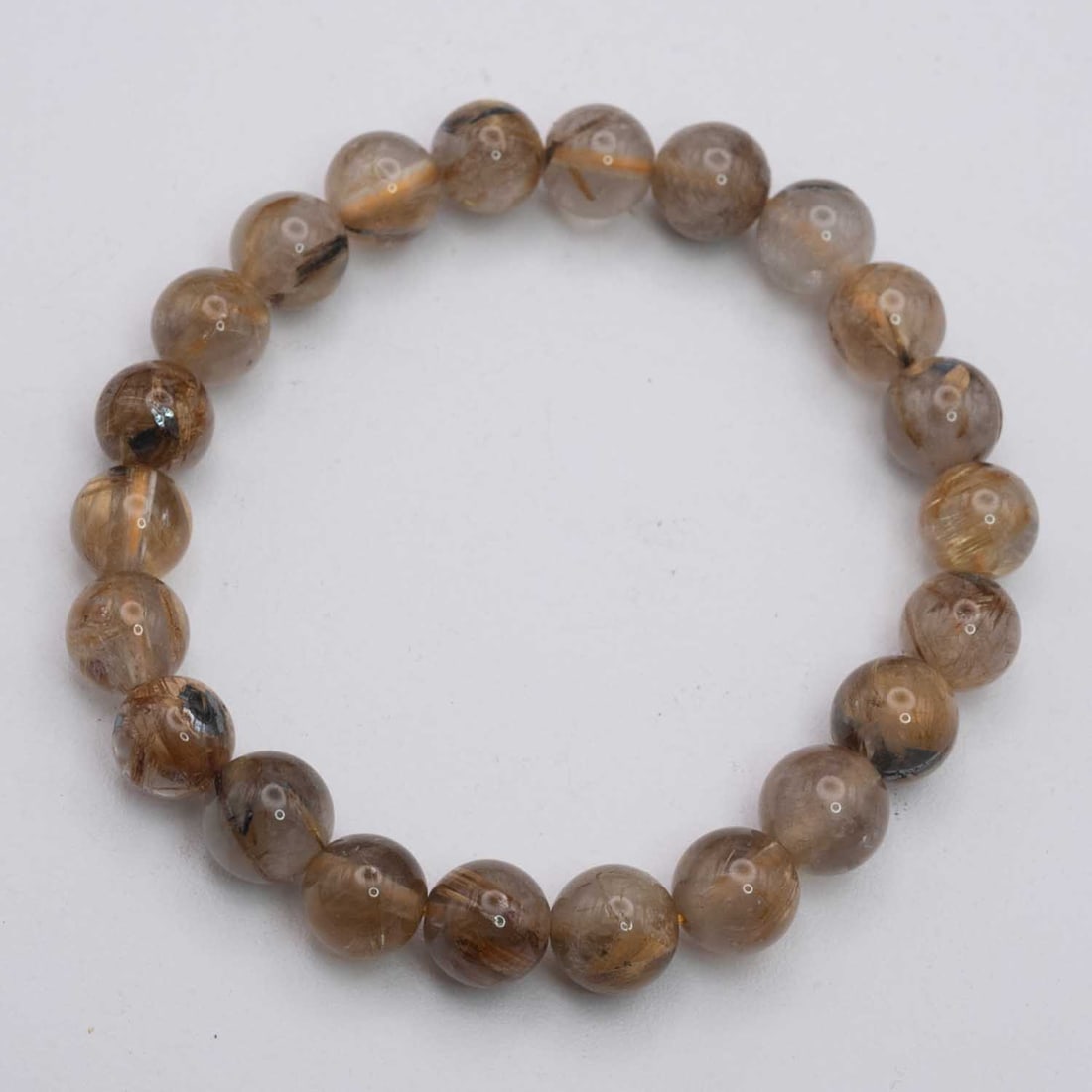 Natural Golden Rutilated Quartz Bracelet: Medium: Golden Rutilated Quartz Size: 9mm diameter each bead Age/Detail: Natural Condition: great overall, check photo for condition reference. Provenance: Collection from Estate in Williamsburg LiveS