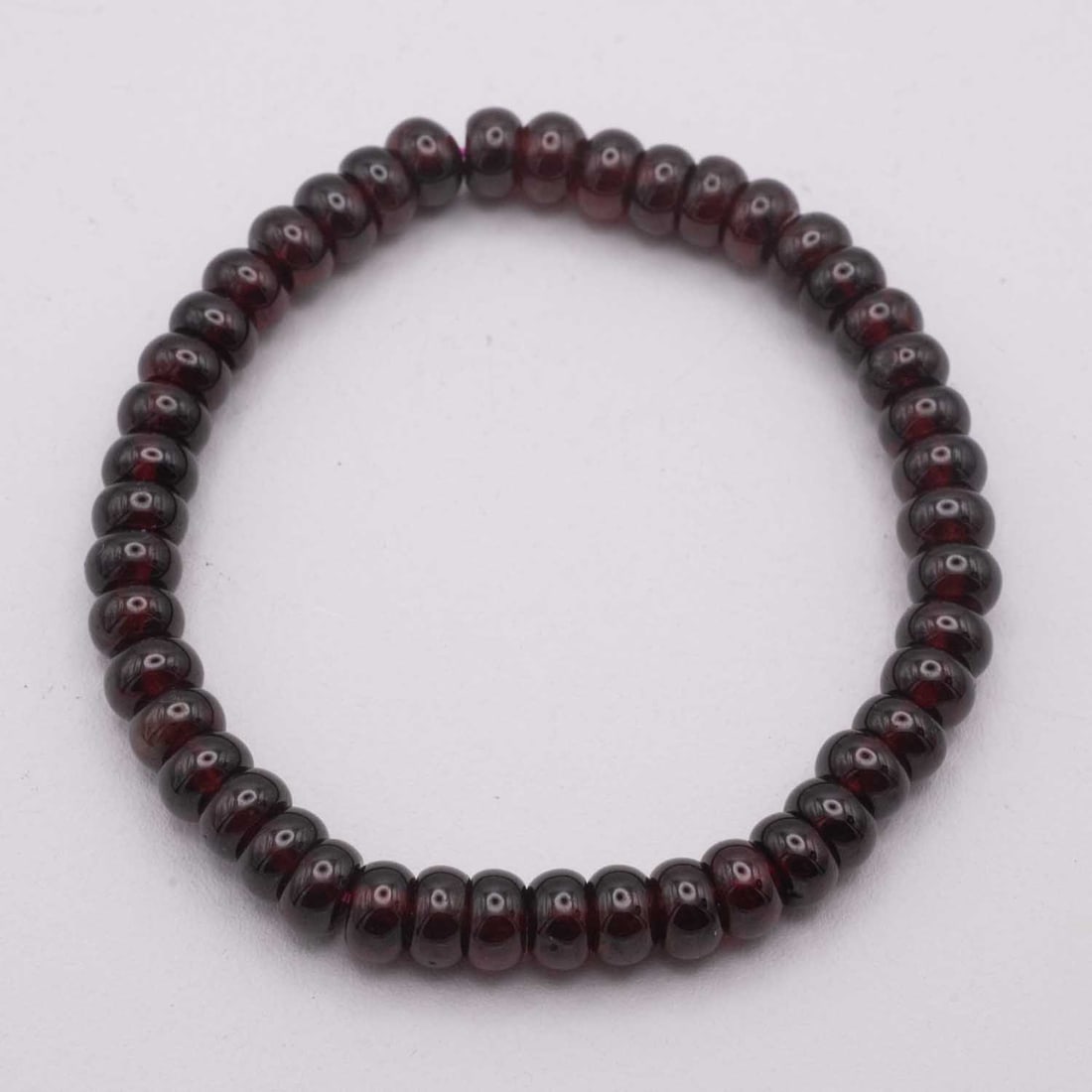 Natural Garnet Bead Bracelet: Medium: Garnet Size: 6x3mm Age/Detail: Natural Condition: great overall, check photo for condition reference. Provenance: Collection from Estate in Williamsburg LiveShipping is NOT a part of the aucti
