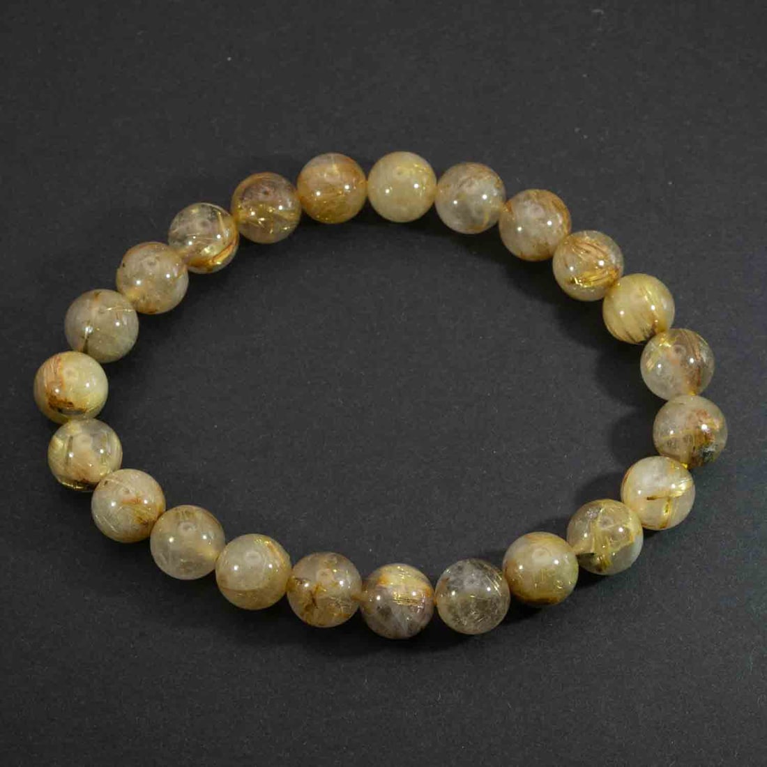 Vintage Natural Golden Rutilated Quartz Bead Bracelet: Medium: Golden Rutilated Quartz Size: 8mm Age/Detail: Vintage Natural Condition: great overall, check photo for condition reference. Provenance: Collection from Estate in Williamsburg LiveShipping is