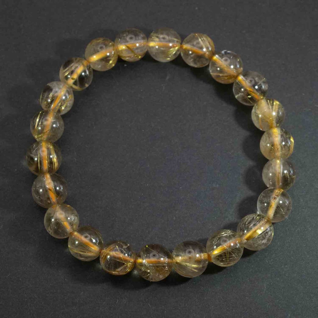 Vintage Natural Golden Rutilated Quartz Bead Bracelet: Medium: Golden Rutilated Quartz Size: 9mm Age/Detail: Vintage Natural Condition: great overall, check photo for condition reference. Provenance: Collection from Estate in Williamsburg LiveShipping is