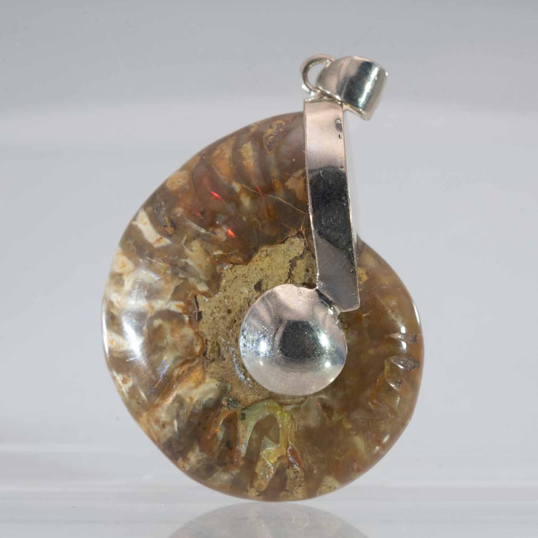 Natural Polished iridescent Fossil Ammolite Pendant: Medium: iridescent Fossil Ammolite Size: 1.5x1.3x0.6 inches Age/Detail: Natural Polished Condition: great overall, check photo for condition reference. Provenance: Collection from Estate in Williamsbu