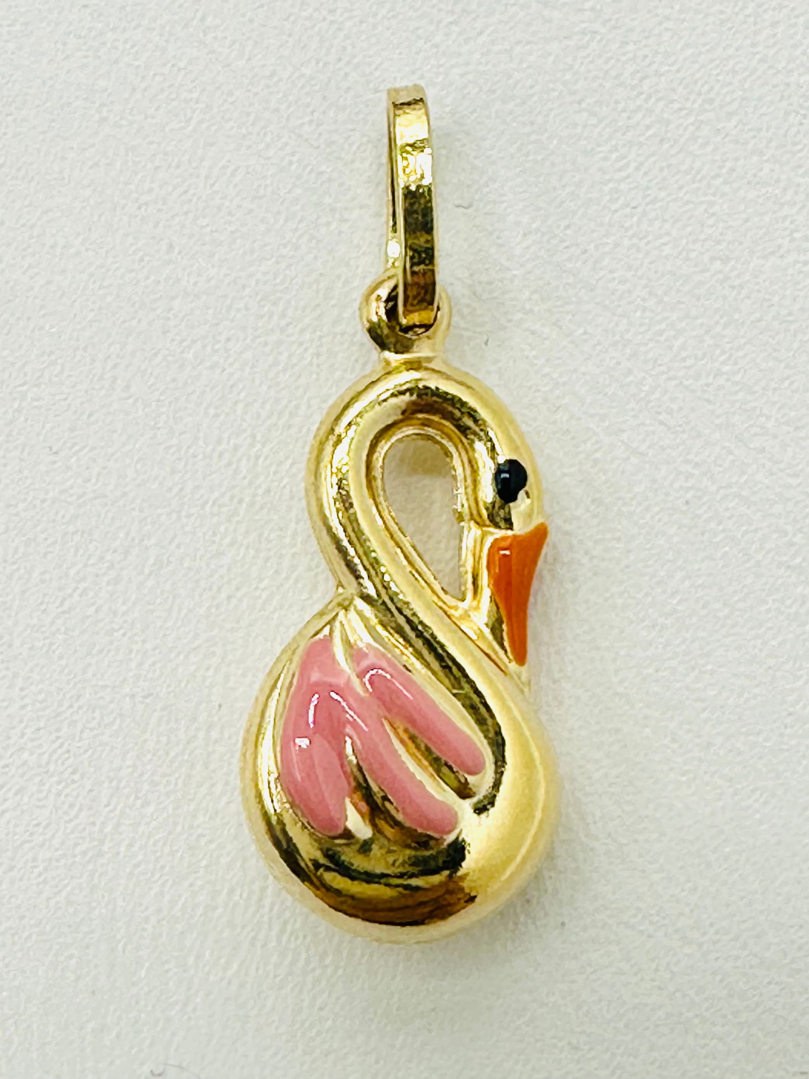 14KT Yellow Gold, lovely Swan Pendant With Enamel # 2705: # 2705 14KT Yellow Gold, lovely Swan Pendant With Enamel Pendant Weight: 1.10 grams (t.w.) Pendant size: 25 mm X 9.50 mm