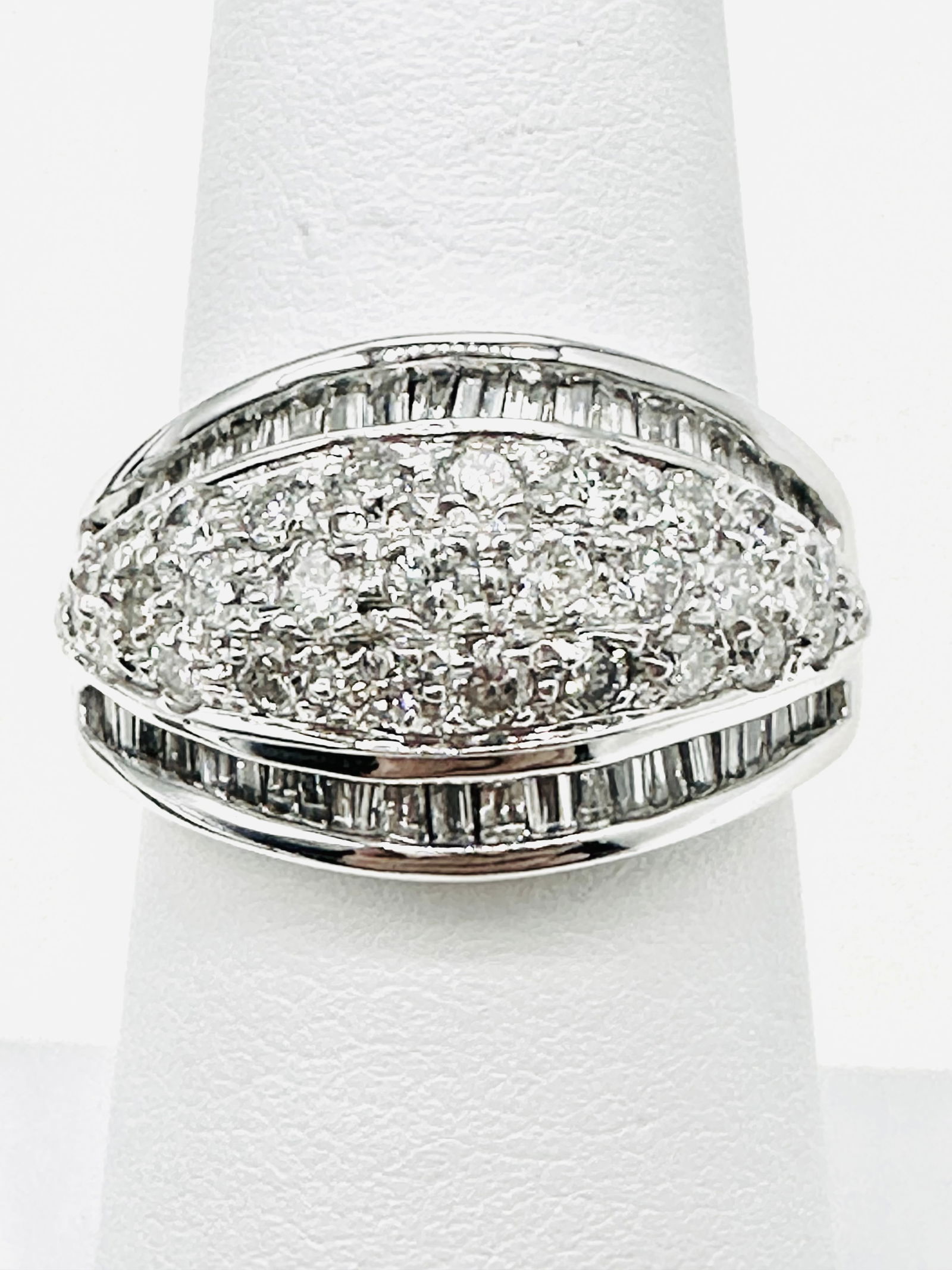 14KT White Gold Natural Diamond Lady’s Ring Size 6.5 - J11424: * 14KT White Gold * Natural Diamond Lady’s Ring * Round and Baguette Diamond 1.55 carats (t.w.) * Diamond Clarity VS-I, Color G-K, * Condition: New in Box * Ring Weight: 7.90grams * Ring size 6.5 *