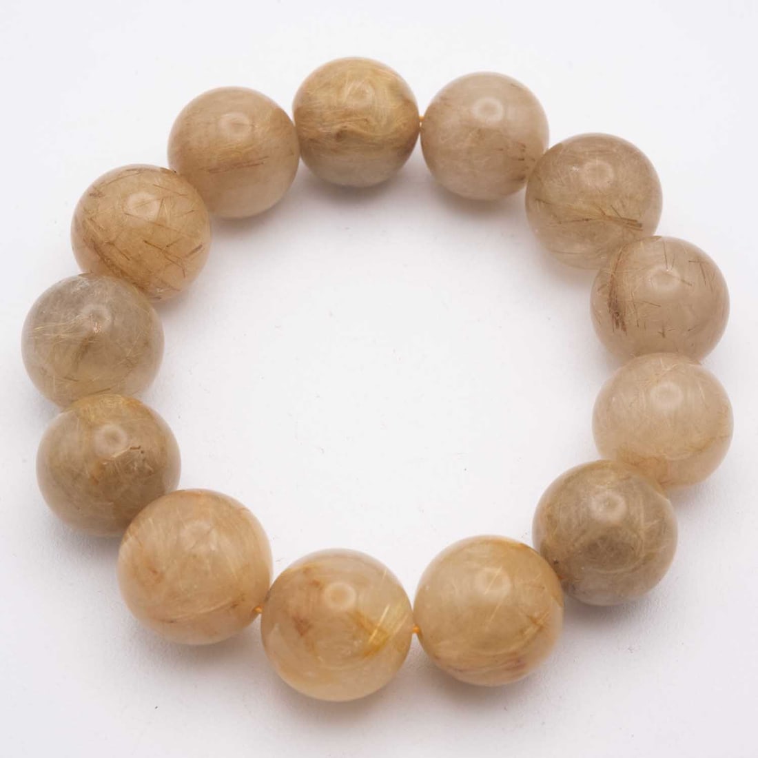 Chinese Golden Rutilated Quartz Bead Bracelet: Medium: Golden Rutilated Quartz Size: 0.6x0.6 inches Age/Detail: Chinese Condition: great overall, check photo for condition reference. Provenance: Collection from Estate in Tribecca LiveShipping is N