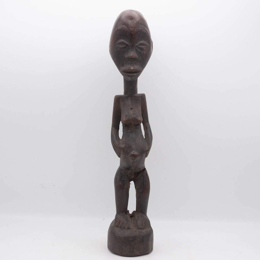 Antique African Tribal Art Wood Female Figure: Medium: Wood Size: 2.5x2.5x12.5 inches Age/Detail: Antique African Tribal Art Condition: great overall, check photo for condition reference. Provenance: Collection from Estate in Williamsburg LiveShip