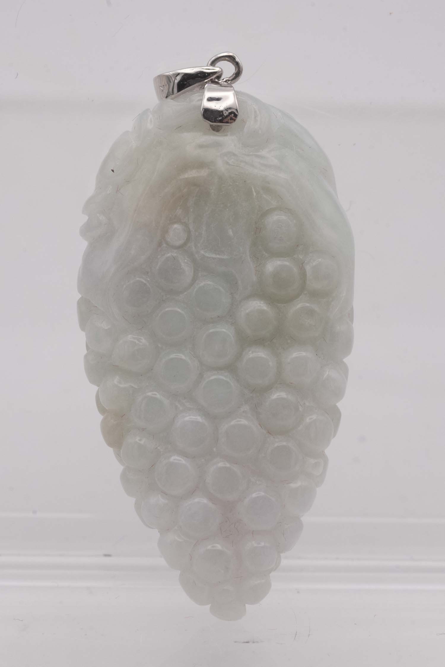 Chinese Carved Jadeite Grapes Pendant: Medium: Jadeite Size: 1.8x1x0.5 inches inner diameter Age/Detail: Chinese Carved Condition: great overall, check photo for condition reference. Provenance: Collection from Estate in Tribecca LiveShipp