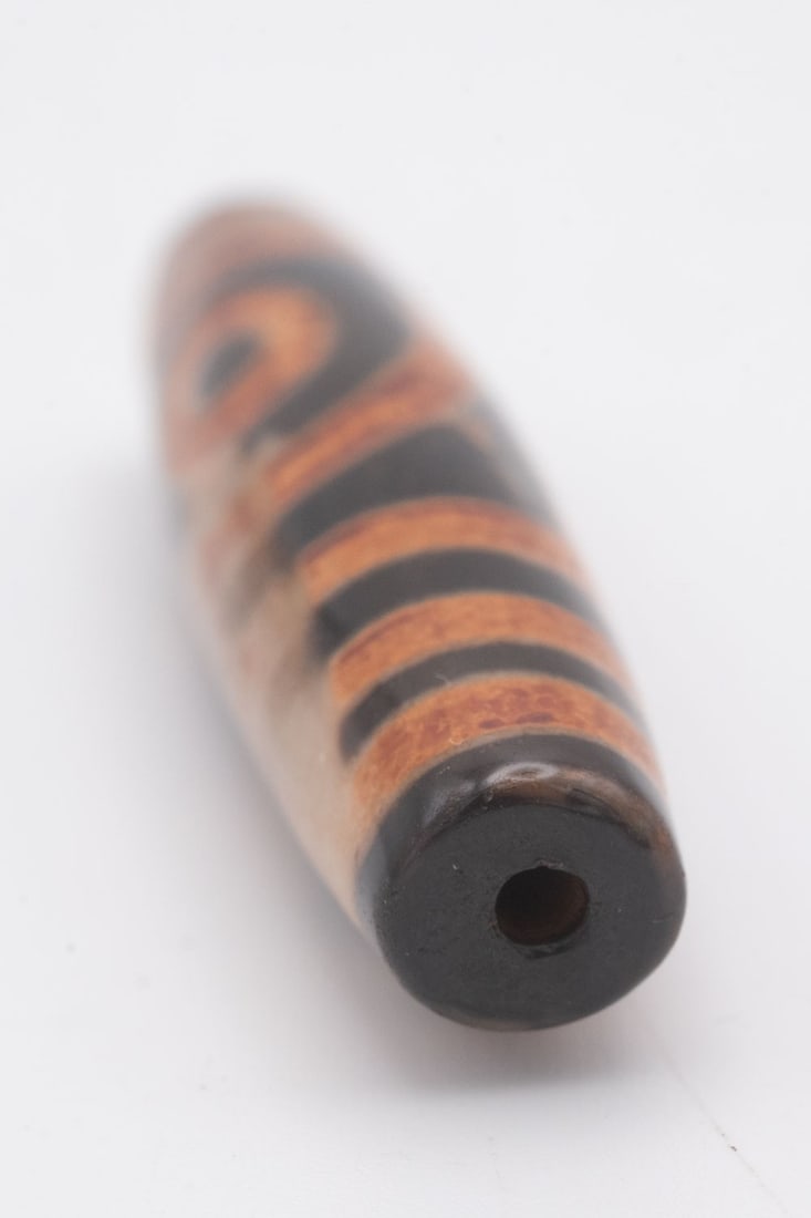 Old Chinese Tibetan Dzi Bead: Medium: Dzi Size: 2x0.5x0.5 inches Age/Detail: Old Chinese Tibetan Condition: great overall, check photo for condition reference. Provenance: Collection from Estate in Tribecca Please view all the pho