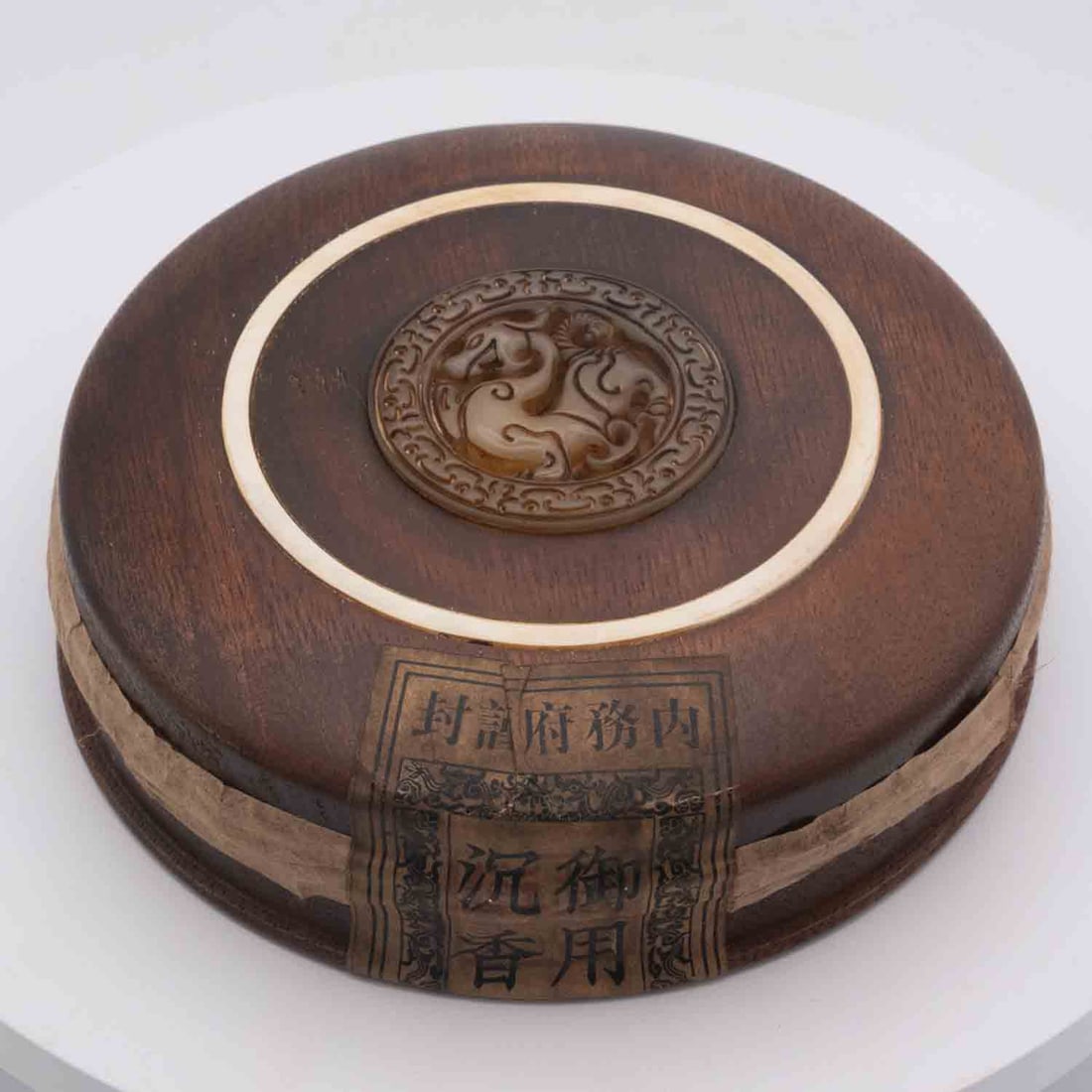 Old Chinese Agarwood In Round Sealed Wood Box: Medium: Agarwood Size: 5.5x5.5x1.7 inches Age/Detail: Old Chinese Condition: great overall, check photo for condition reference. Still sealed, not able to determine items inside Provenance: Collection