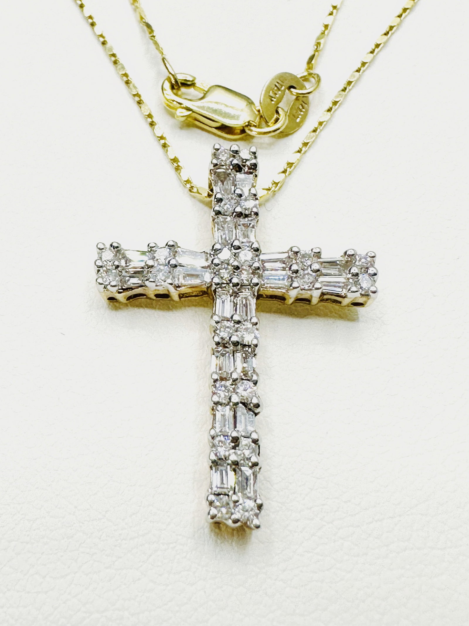 14KT Yellow Gold 44 Pcs Round And Baguette Cut Diamond Necklace - J11167: * 14KT Yellow Gold Natural Diamond Cross Pendant with 16” Fancy Chain * 44 pcs round and baguette cut diamond 0.80 Carat (t.w.) * Clarity VS-SI, Color G-K * Pendant and Chain Weight 3.80 Grams *