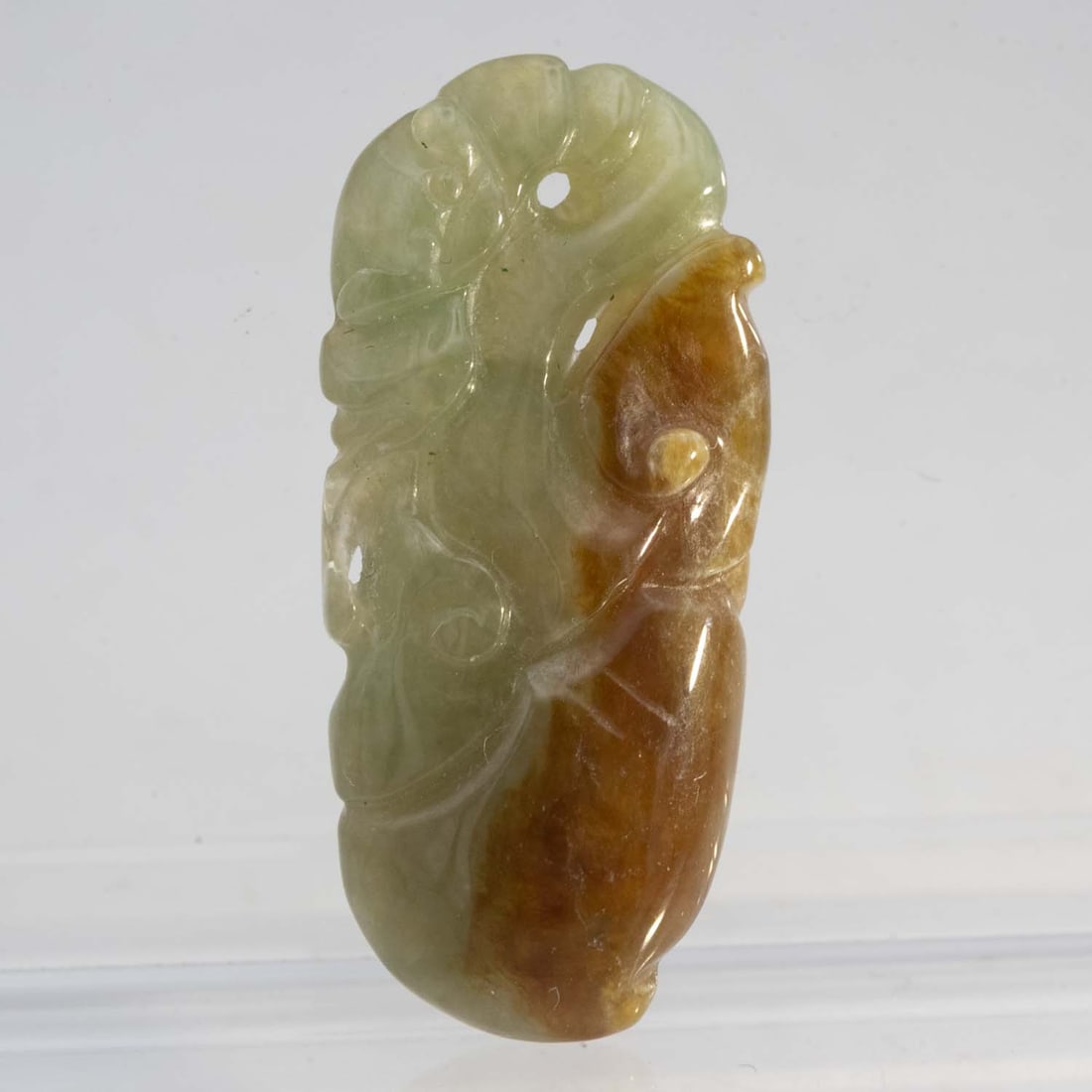 Chinese Carved Green And Red Jadeite Pendant: Medium: Green And Red Jadeite Size: 1.2x0.6x0.3 inches Age/Detail: Chinese Carved Condition: great overall, check photo for condition reference. Provenance: Collection from Estate in Williamsburg Live