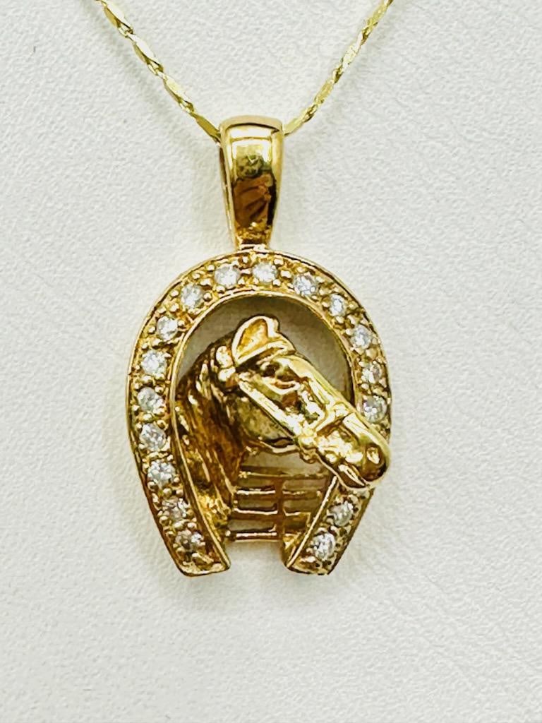 14KT Yellow Gold Natural Diamond Horse Shoes Pendant and Chain # 2008: # 2008 14KT Yellow Gold Natural Diamond Horse Shoes Pendant and Chain 19 pcs diamond 0.25 carat (t.w.) 16” fancy chain with lobster lock clasp closure Pendant and Chain Weight: 4.80 grams Pendan
