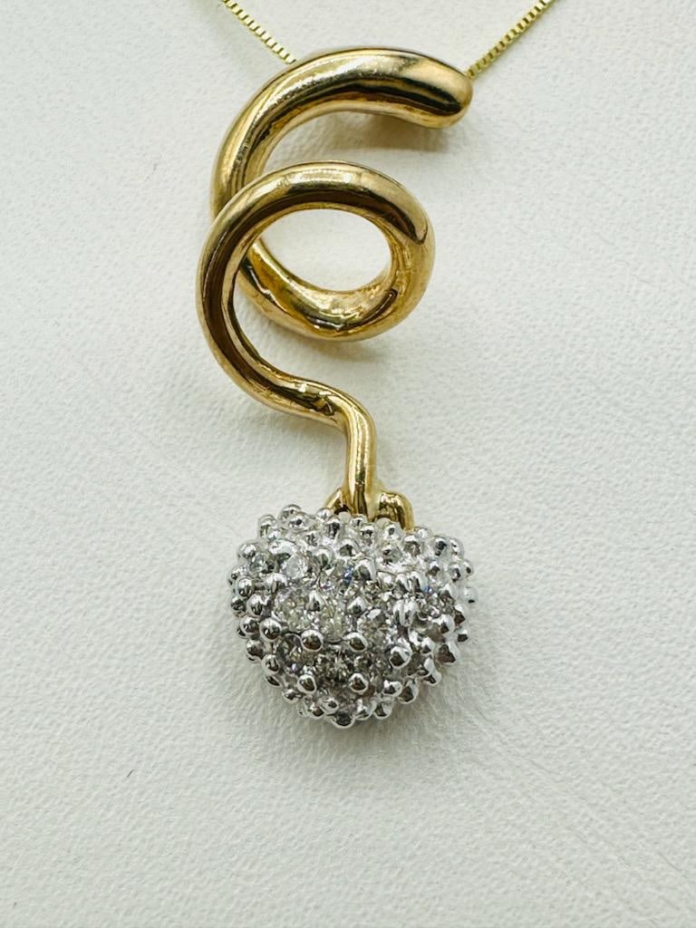 14KT Yellow Gold Natural Diamond Heart Pendant and Chain # 2011: # 2011 14KT Yellow Gold Natural Diamond Heart Pendant and Chain 11 pcs diamond 0.16 carat (t.w.) 18” box chain with spring ring clasp closure Pendant and Chain Weight: 3.10 grams Pendant: 26 mm 