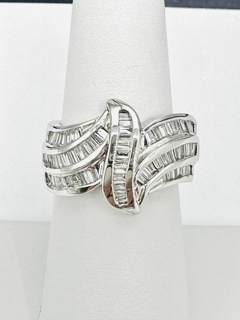14KT White Gold Natural Diamond Ring # 2050: # 2050 14KT White Gold Natural Diamond Ring Baguette diamond 1.45 carats (t.w.) Ring Weight: 7.80 grams Ring Size: 6.75