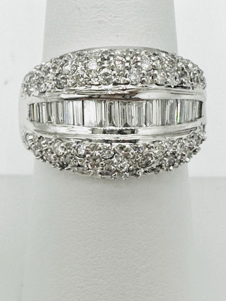 14KT White Gold Natural Diamond Wide Band # 2051: # 2051 14KT White Gold Natural Diamond Wide Band Round and baguette diamond 1.70 carats (t.w.) Ring Weight: 8.20 grams Ring Size: 7.25