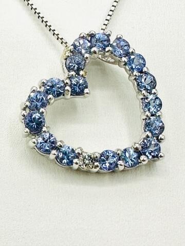 14KT White Gold Natural Tanzanite and Diamond Heart Pendant and Chain # 2105: # 2105 14KT White Gold Natural Tanzanite and Diamond Heart Pendant and Chain 1 piece diamond 0.05 carat 17 pieces tanzanite 2.35 carats ( t.w.) 16” box chain with lobster lock clasp closure Pend