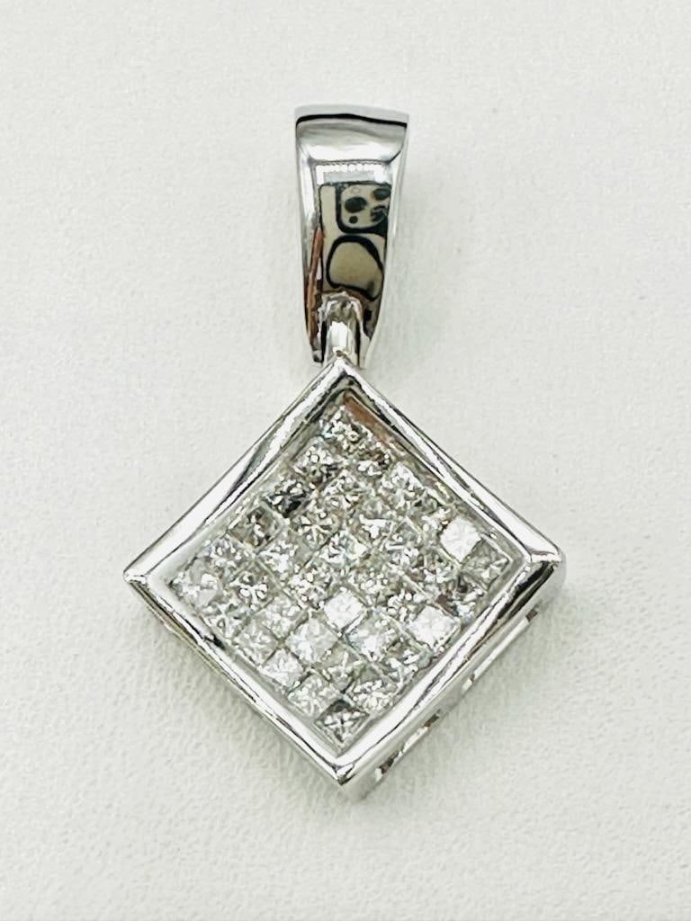 14KT White Gold Natural Diamond Pendant # 2138: # 2138 14KT White Gold Natural Diamond Pendant 36 pieces princess cut diamond 0.50 carat(t.w.) Pendant Weight: 2.70 grams Pendant size: 23 mm x 14 mm