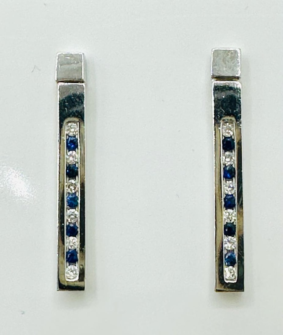 14KT White Gold Pair of Natural Diamond and Sapphire Earrings 12 Pieces Diamond 0.18 carat(t.w.) #: # 2170 14KT White Gold Pair of Natural Diamond and Sapphire Earrings 12 Pieces Diamond 0.18 carat(t.w.) 10 Pieces sapphire 0.30 carat( t.w.) Earrings Weight: 2.80 grams Push backs Earrings size: 24 mm